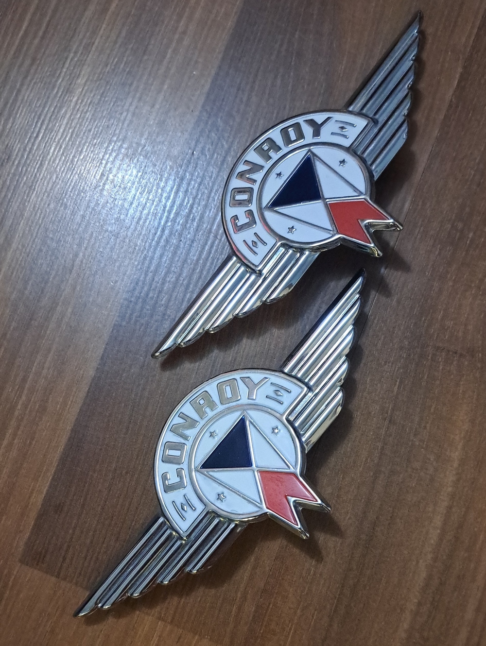 Conroy Wing Emblem Badge - Chrome with Blue, Red, and White Accents